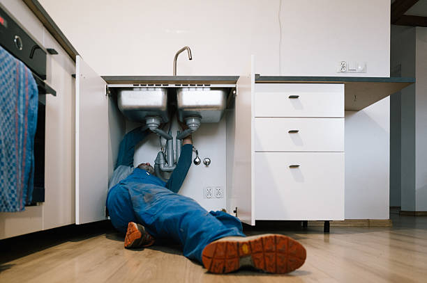 Professional Plumbing technician working in Highland, IL